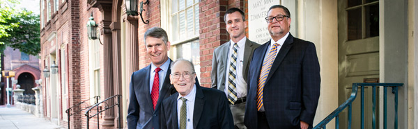 lawyers posing outside