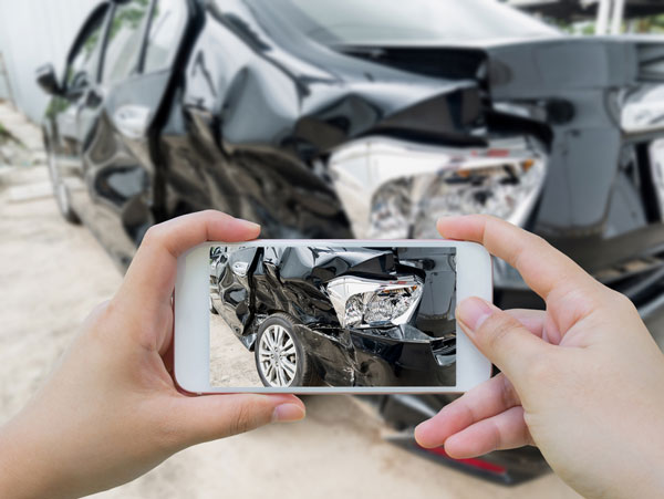taking a photo of a car accident