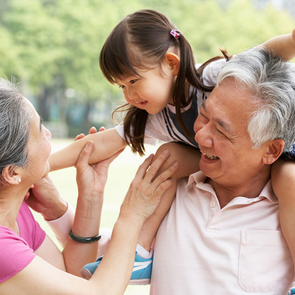 grandparents playing with granddaughter