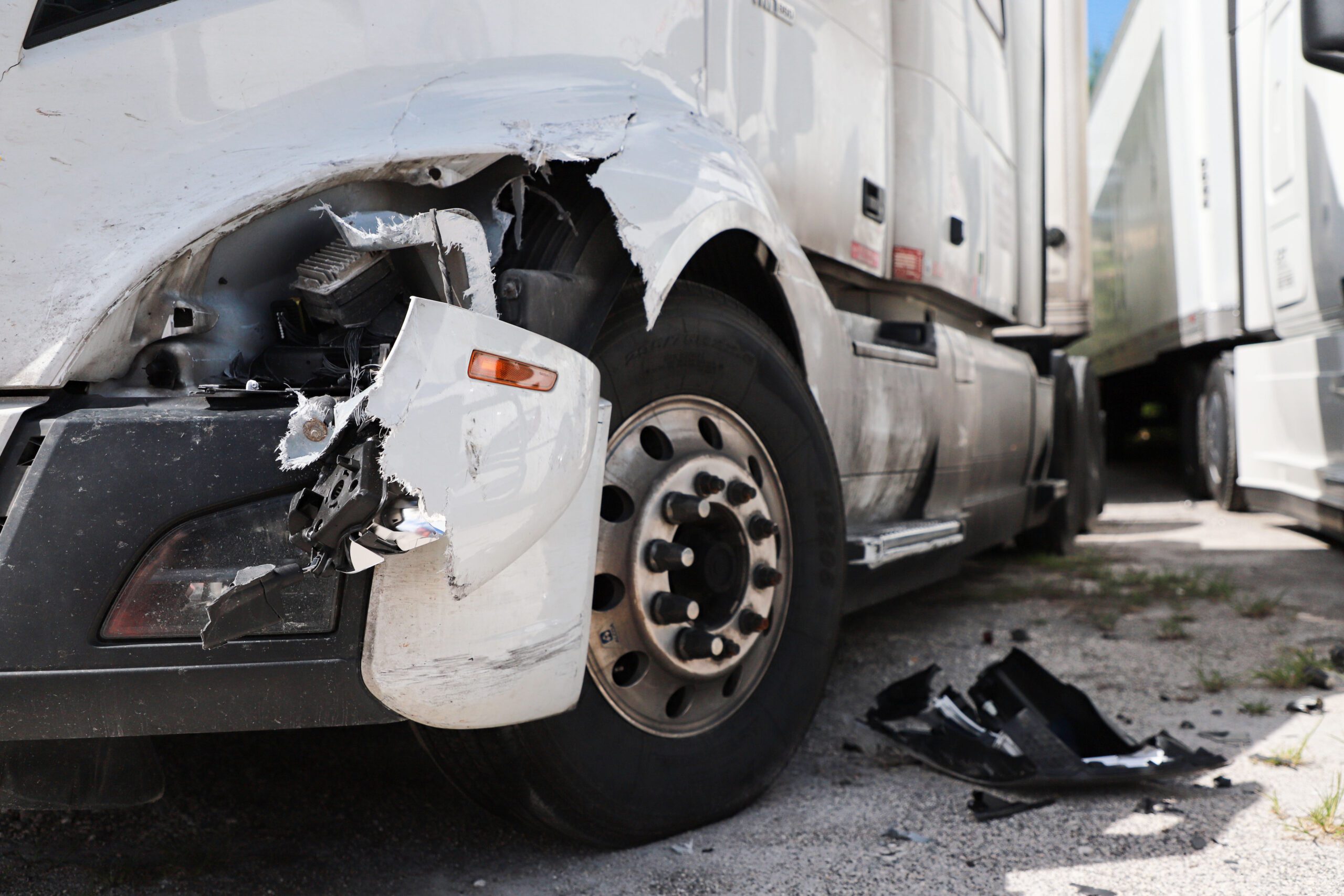 Damage closeup on white truck.